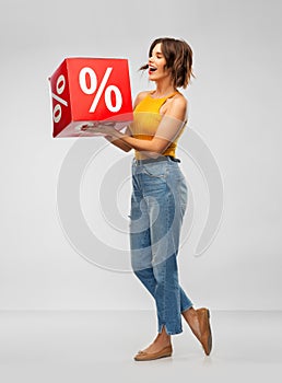 Happy smiling young woman with sale sign