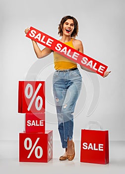 Happy smiling young woman with shopping bags