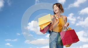 Happy smiling young woman with shopping bags