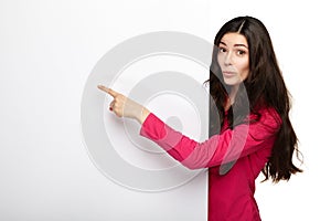 Happy smiling young woman showing blank signboard.