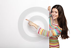 Happy smiling young woman showing blank signboard.