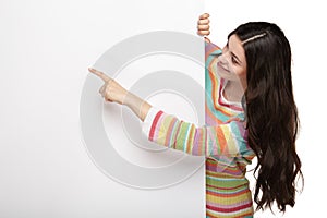 Happy smiling young woman showing blank signboard