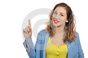 Happy smiling young woman showing empty blank signboard with cop