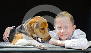 Happy smilling little girl and beagle puppy