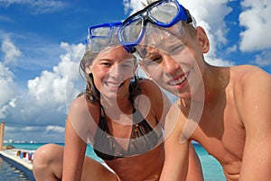 Happy snorkel teens at beach