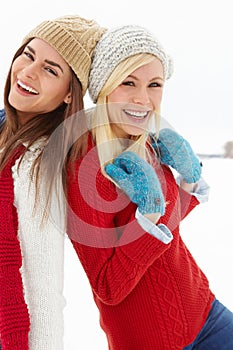 Happy, snow and portrait of girl friends on winter vacation, adventure or holiday for travel. Smile, confident and young