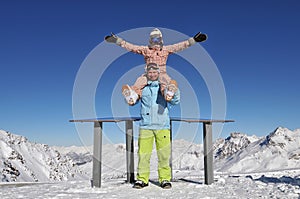 Happy snowboarders in ski resort