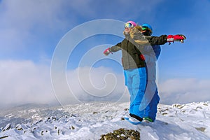 Happy snowboarding couple