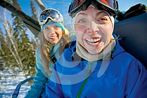 Happy snowboarding girls