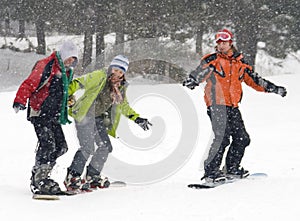 Happy snowboarding teens team photo