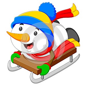 A happy snowman is palying and sliding with the ice cart