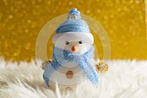 Happy snowman standing in winter christmas snow background. Merry christmas and happy new year greeting card with copy-space.