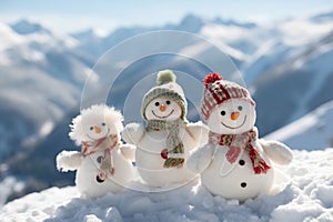 Happy snowmans in mountains, copy space