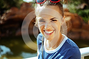 Happy solo traveller woman having picturesque river cruise