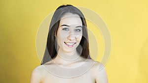 Happy speaking girl on yellow background in 4K