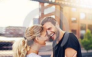 Happy spontaneous couple share a good joke