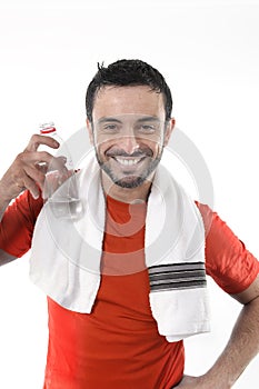 Happy sport man posing corporate with water and towel for fitness center