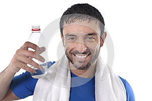 Happy sport man posing corporate with water and towel for fitness center