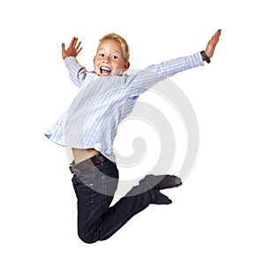 Happy sportive boy jumps in the air