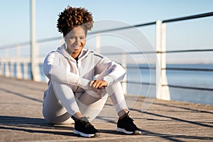 Happy Sporty Black Woman In Activewear Relaxing After Fitness Training Outdoors