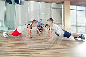 Happy sporty children in gym.