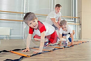 Happy sporty children in gym.