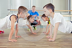 Happy sporty children in gym.