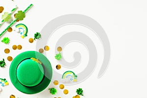 Happy St Patrick`s Day banner template. Flat lay composition with leprechaun hat, confetti, party decorations on white table