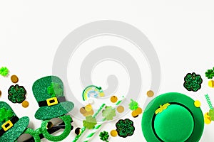 Happy St Patrick`s Day banner template. Flat lay composition with leprechauns hat, party eyeglasses, confetti, decorations on