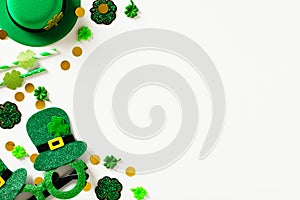 Happy St Patrick`s Day greeting card template. Flat lay composition with leprechaun hat, confetti, party eyeglasses, decorations