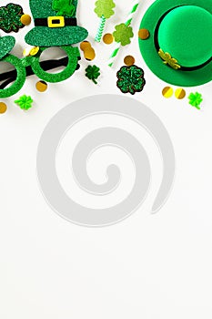 Happy St Patrick`s Day vertical banner template. Frame top border made of party eyeglasses, leprechauns hat, shamrock clover,
