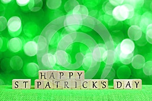 Happy St Patricks Day blocks with twinkling green background