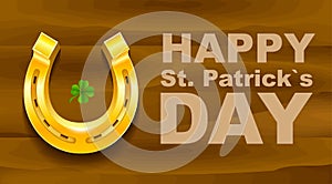 Happy St Patricks Day. Golden Horseshoe and quatrefoil clover on wooden board. Template greeting card