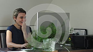 happy stoked adult female reading good news email on computer monitor at desk