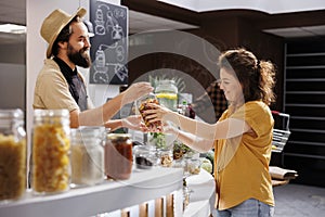 Happy store vendor sells pasta