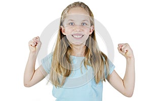 Happy strong little girl showing hands bicep strength make fists feels healthy posing. Studo shot