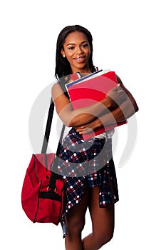 Happy student with binders and bag