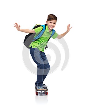 Happy student boy with backpack and skateboard