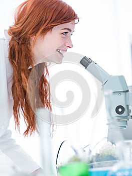 Happy student in chemistry lab photo