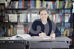 Happy student doing homework