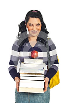 Happy student female with pile of books