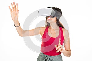 Happy student girl excited with VR game on white background young woman in virtual reality headset standing hands up