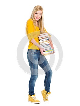 Happy student girl holding stack of books