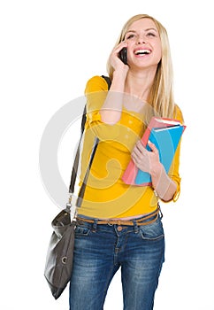 Happy student girl speaking mobile