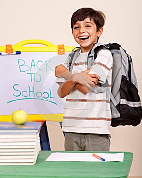 Happy student in his classroom