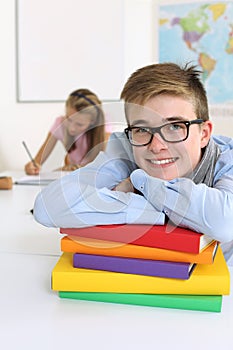 Happy student in his classroom