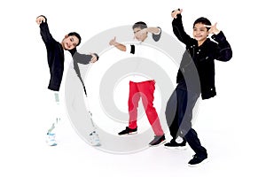 Happy student kid group studying modern style dance in studio classroom. Portrait of three children, boys and girl in casual