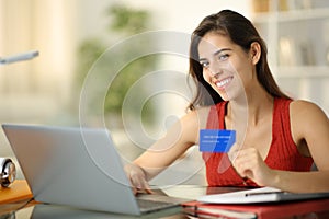 Happy student looks at you buying online