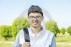 Happy Student portrait with bag,outdoor.