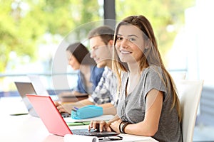 Happy student posing in a classroom